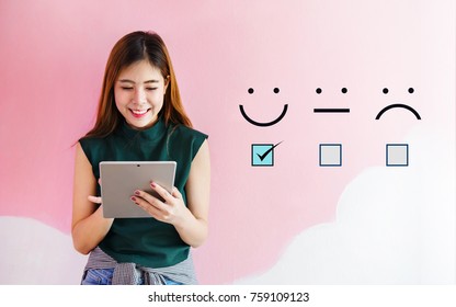 Customer Experience Concept, Happy Client Woman Holding Digital Tablet With A Checked Box On Excellent Smiley Face Rating For A Satisfaction Survey