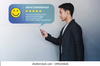 Customer Experience Concept. Young Businessman Reading A Positive Review Via Smartphone. Online Satisfaction