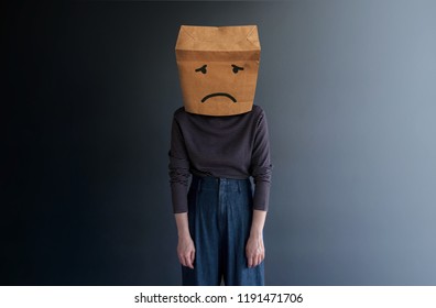 Customer Experience or Human Emotional Concept. Woman Covered her Face by Paper Bag and present Sad Feeling by Drawn Line Cartoon and Body Language - Shutterstock ID 1191471706