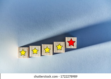 Customer Experience. Rate With Stars. Wooden Blocks On Blue Background. Total Satisfaction. Service Rating Concept