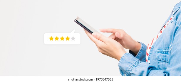 Customer Experience Ratings Concept. A Stylish Woman Using A Smartphone To Submit Stars Feedback, And Review To Products Or Services She Quite Satisfied. Marketing Business Important Tools. Surveys.