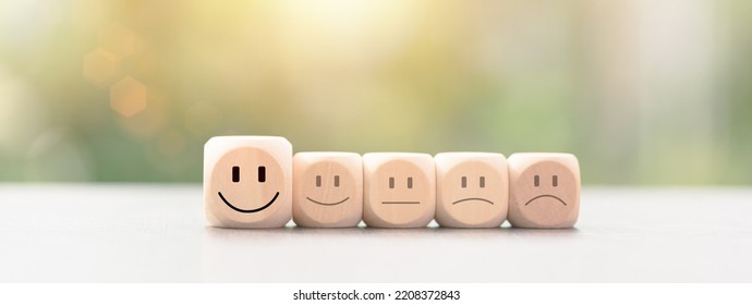 Customer Experience Survey Concept For Service And Product And Customer Engagement, Best Satisfaction Rating, Positive Feedback, Wooden Blocks Lined Up On The Table, Smiley Icon, Nature Background