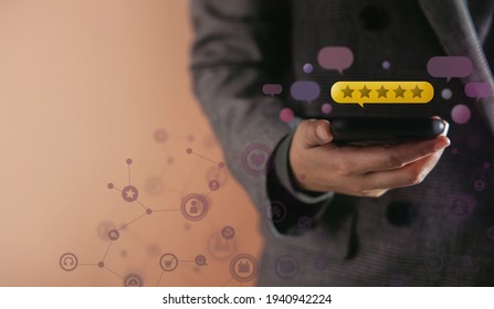 Customer Experiences Concept. Happy Client Using Smartphone To Giving Best Excellent Review Rating For Online Satisfaction Surveys . Surrounded By Feedback From Others Floating Over A Mobile Phone