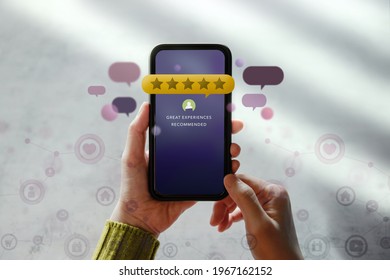 Customer Experiences Concept. Happy Client Using Smartphone To Reading Review Rating For Online Satisfaction Surveys. Positive Feedback On Mobile Phone