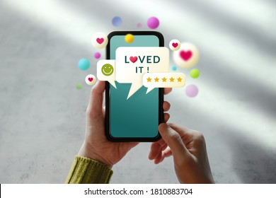 Customer Experiences Concept. Woman Using Mobile Phone to Giving Feedback via the Internet. Positive Review. Client Satisfaction Surveys - Shutterstock ID 1810883704