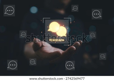 Customer feedback concept with speech bubble icons glowing above hand. Online communication review response reputation management user engagement and digital customer experience strategy.