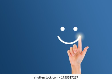 Customer Feedback Concept : Woman finger touch on smiley emotional symbol. - Shutterstock ID 1755517217