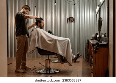 Customer getting fashion hairstyle in barber shop - Powered by Shutterstock