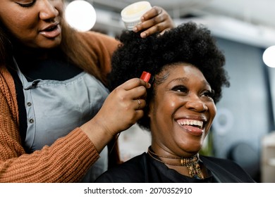 Customer getting a hairdo at a beauty salon - Shutterstock ID 2070352910