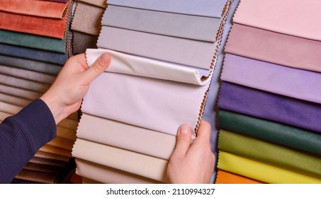 The Customer Looks At And Selects The Color Fabric She Likes, Selects The Fabric From The Fabric Swatches For Her New Sofa.