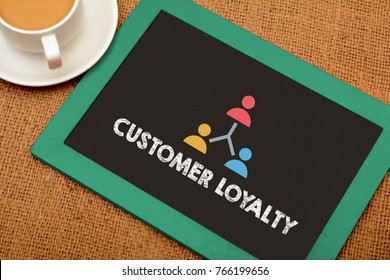 Customer Loyalty Concept On Chalkboard With Tea