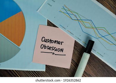 Customer Obsession Write On Sticky Notes Isolated On Wooden Table.