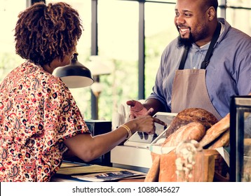 Customer ordering pasrty at counter - Powered by Shutterstock