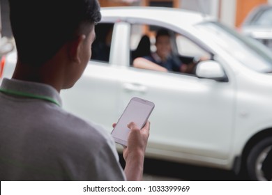 customer ordering taxi via online apps from his mobile phone