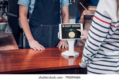 Customer Pay Drink With Bitcoins On Tablet Screen At Cafe Counter Bar,seller Coffee Shop Accept Payment By Crypto Currency.digital Money Concept