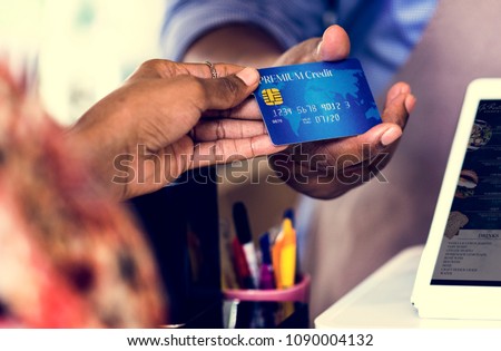 Customer paying for bakery products by credit card