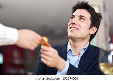 Customer Paying Bill At The Restaurant With His Credit Card