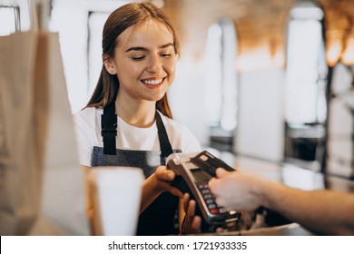 Customer Paying With Card In A Coffee House