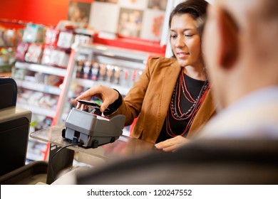 Customer Paying For Purchase With Mobile Phone