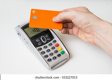 Customer Is Paying Using Contactless Credit Card And Payment Terminal.