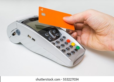 Customer Is Paying Using Contactless Credit Card And Payment Terminal.