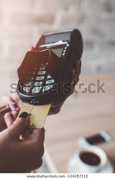 Customer pays by credit
card at the cafe
