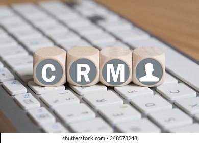 customer relationship management as acronym on tiny cubes