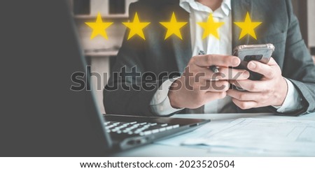 Customer review good rating concept, People use smartphone for online review with icon five star for positive customer feedback testimonial.	