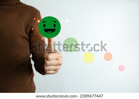 Customer satisfaction concept, client is satisfied with pressing the smiley face icon, excellent service, impressed with care, highest rating and score, good feedback from users.