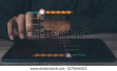 Customer satisfaction experience concept. Businessman giving high score with five golden stars rating satisfaction in service. rating very impressed. copy space.