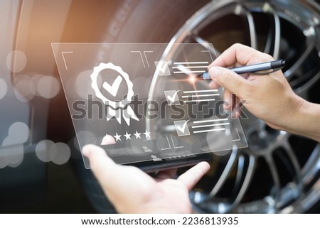 Customer Satisfaction Guarantee concept on virtual screens, Employees check the conditions of quality assurance of car service  with digital document on smartphone modern work car service 