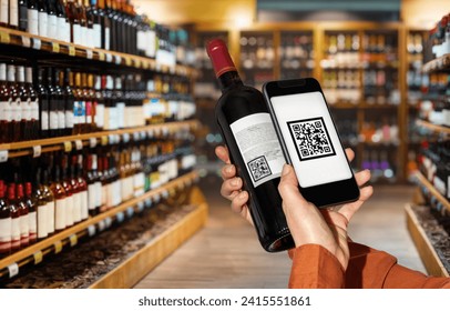 Customer scans qr code on wine bottle by smart phone in liquor store. - Powered by Shutterstock