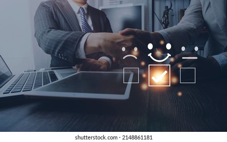 Customer service evaluation concept. Businessman pressing face smile emoticon show on virtual screen. Survey, poll or questionnaire for user experience or customer satisfaction research. - Shutterstock ID 2148861181