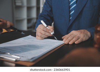 Customer service good cooperation, Consultation between a Businessman and Male lawyer or judge consult having team meeting with client, Law and Legal services concept. - Shutterstock ID 2360663901