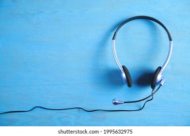 Customer Service Headset On The Blue Background.