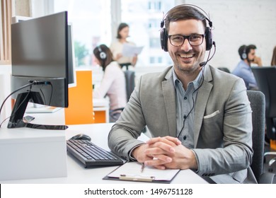 Customer Service Representative Business Man With Headset In Call Center