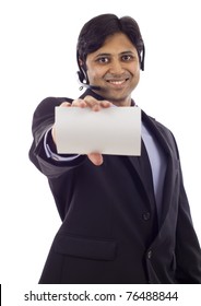 Customer Service Representative With Headset Holding A Blank Empty Card Isolated Over White Background