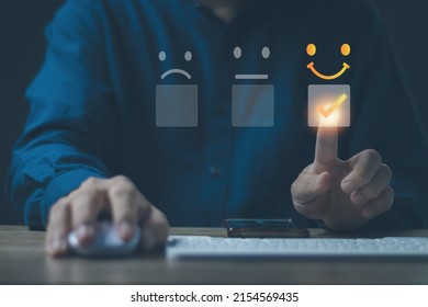 Customer service and Satisfaction concept Men's hands doing online assessments in the satisfaction rating the popular service company allows customers in order to improve and develop the organization - Shutterstock ID 2154569435