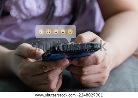 Similar – woman using smartphone sending emojis.