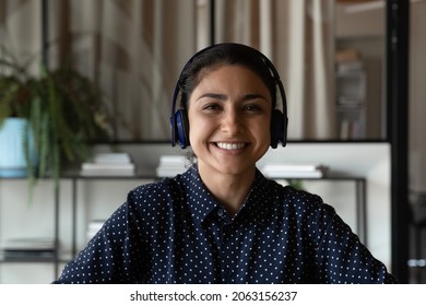 Customer Service. Screen View Portrait Of Pleasant Young Indian Woman Client Support Specialist In Headset Look At Web Camera. Smiling Ethnic Lady Remote Interpreter Call Center Operator Do Job Online