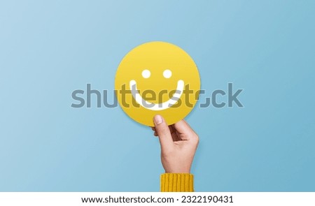 Customer show speech balloon with smile emoticon for rating. Service rating, feedback, satisfaction concept