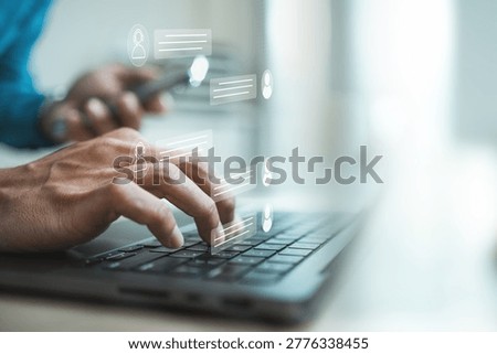 Customer support agent using laptop with virtual live chat interface, representing online assistance, instant messaging, CRM service, AI chatbot communication, help desk response.