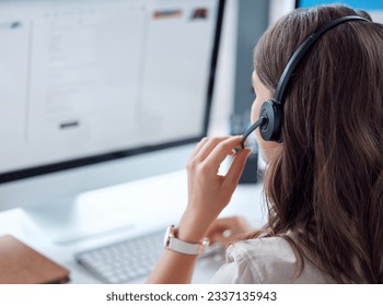 Customer support, call center and back of female agent working on online consultation in the office. Telemarketing, communication and saleswoman planning crm with headset and computer in workplace.
