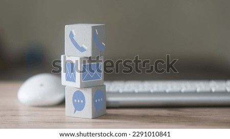 Customer support concept. Stack wood block with icons of contact methods, phone, email, address and chat message for design banner website. Concept of customer support, hotline and contact us