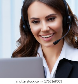 Customer Support Female Phone Operator Or Sales Agent In Headset And Confident Black Suit, With Laptop At Office Workplace. Consulting And Assistance Service Call Center. Square Size. Zoom Conference.