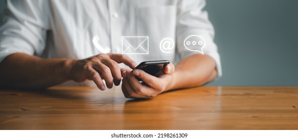 Customer support hotline Contact us people connection. Businessman using Smart Phone with the email, call phone, address, Chat message icons.	 - Shutterstock ID 2198261309