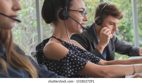 Customer support operator at work. Call center worker with team. Customer Services Agent With Headset Working