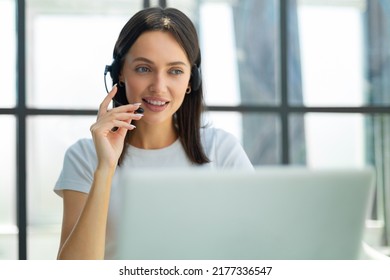 Customer support operator working in a call center office.