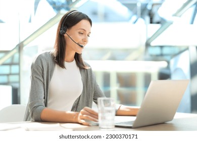 Customer support operator working in a call center office