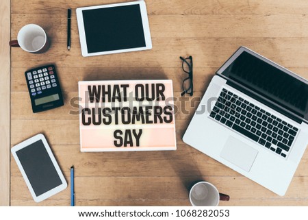 Customer testimonials message in lightbox on office desk